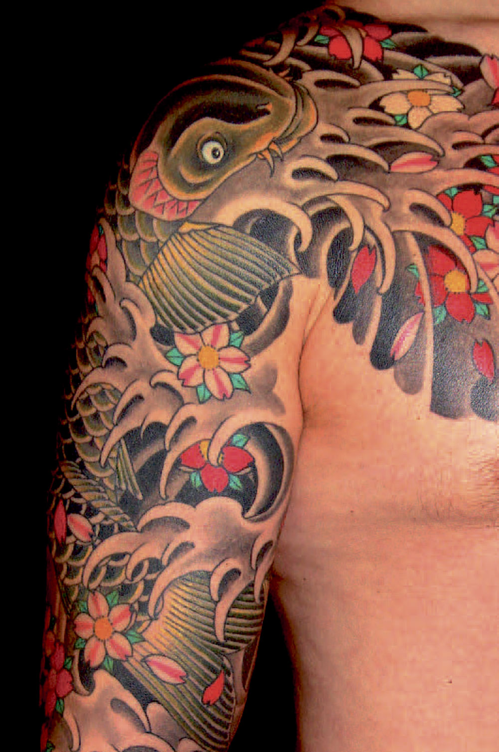 Det var koi-tatoveringer somdenne Henning Jørgensen fra Royal Tatoo fik sit verdensgennembrud på.