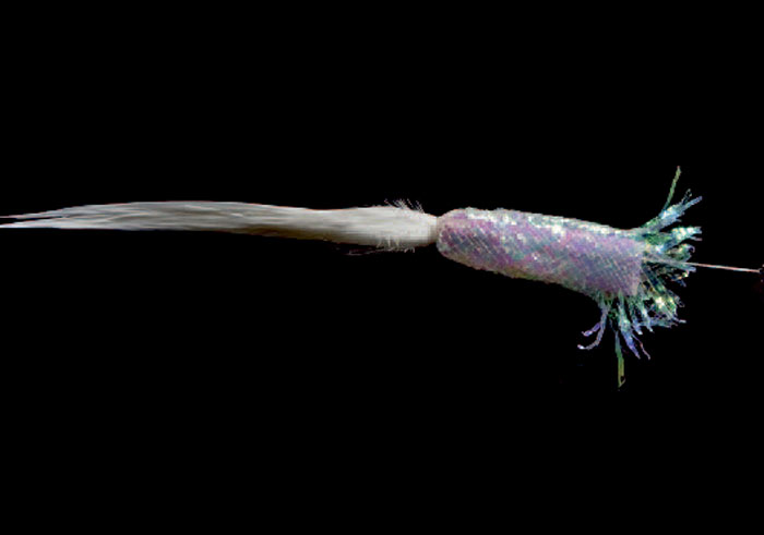 5: Vrid vrangen ud på mylarslangenog tilbage over foamen. Tag nålen ud.